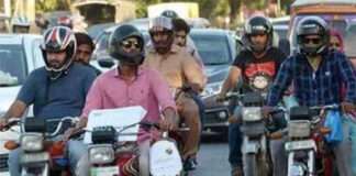 Lahore prohibits motorcycle riders without helmets from using major highways.