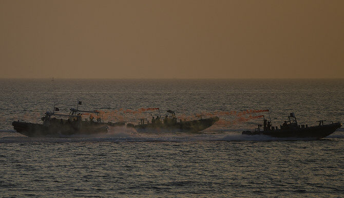 A Pakistan Navy ship rescues eight Iranian fishermen at sea