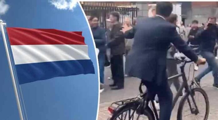 The outgoing Prime Minister of the Netherlands sets an example of simplicity by riding home on a bicycle
