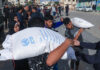Israel shuts down UN Palestinian refugee agency as 60 dead in Lebanon attacks